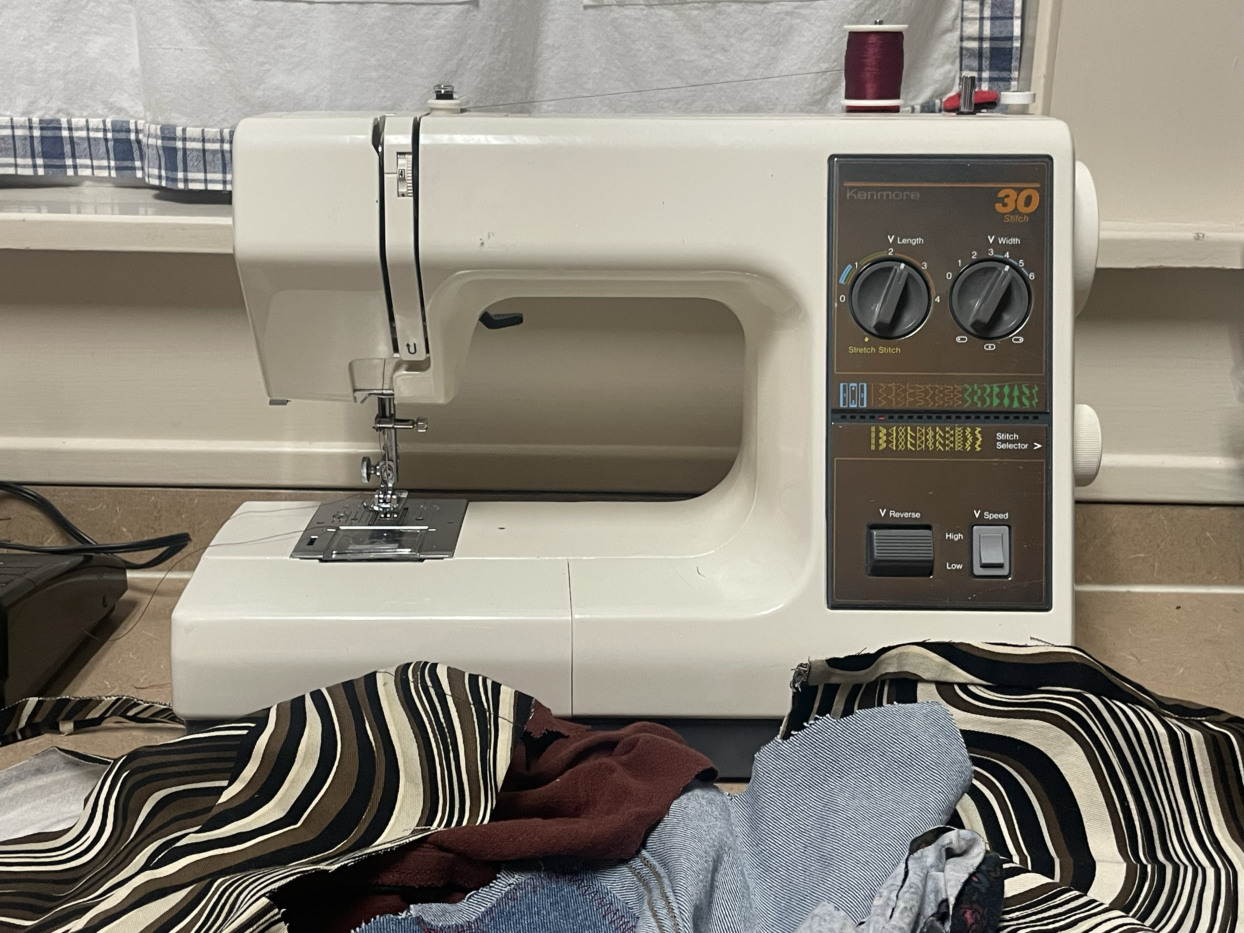 Sewing machine header